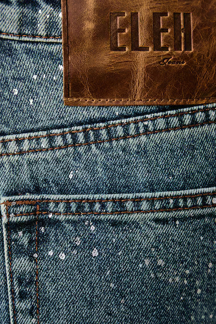 Niebieskie jeansy wide leg ELEH ze srebrnymi plamkami